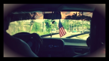 A taxi, driven by Dari, featured an American flag.
